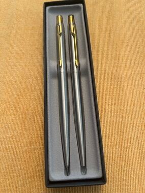 Parker Classic stainless steel gold trim ballpen and mechanical pencil set.